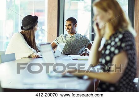 People working at conference table in office View Large Photo Image Stock Image - People working at conference table in office. Fotosearch