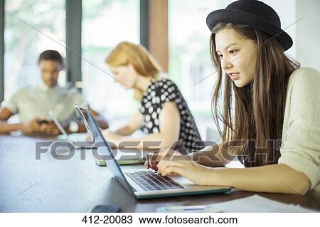 People working at conference table in office View Large Photo Image Stock Image - People working at conference table in office. Fotosearch