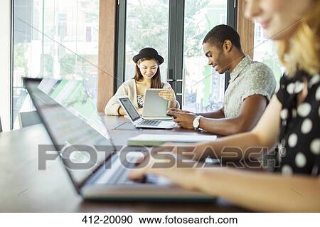 People working at conference table in office View Large Photo Image Stock Image - People working at conference table in office. Fotosearch