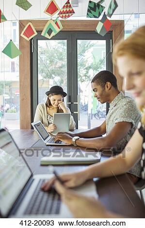 People working at conference table in office View Large Photo Image Stock Image - People working at conference table in office. Fotosearch