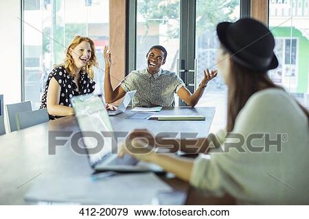 People working at conference table in office View Large Photo Image Stock Photo - People working at conference table in office. Fotosearch