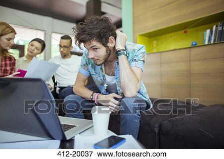 People working at laptop in office View Large Photo Image Stock Photo - People working at laptop in office. Fotosearch