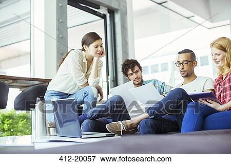 People working together in office View Large Photo Image Stock Photo - People working together in office. Fotosearch