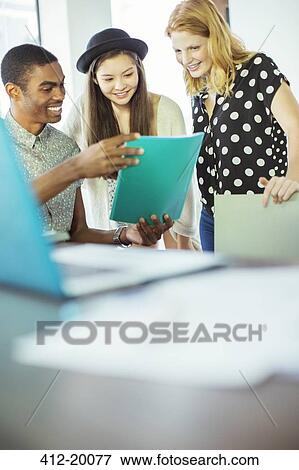 People working together in office View Large Photo Image Stock Photo - People working together in office. Fotosearch