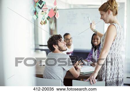 People working together in office View Large Photo Image Stock Photography - People working together in office. Fotosearch