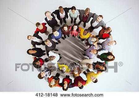 Portrait of confident business people in circle View Large Photo Image Stock Photo - Portrait of confident business people in circle. Fotosearch