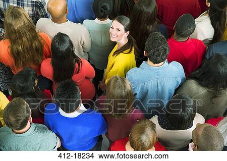 Portrait of confident businesswoman in crowd View Large Photo Image Picture - Portrait of confident businesswoman in crowd. Fotosearch