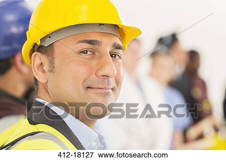 Stock Photo - Portrait of confident construction worker. Fotosearch