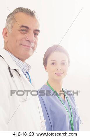 Portrait of confident doctor and nurse View Large Photo Image Stock Image - Portrait of confident doctor and nurse. Fotosearch