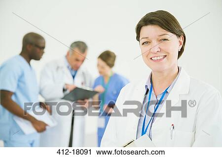 Portrait of confident doctor View Large Photo Image Stock Image - Portrait of confident doctor. Fotosearch