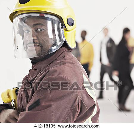 Portrait of confident fireman View Large Photo Image Stock Photography - Portrait of confident fireman. Fotosearch