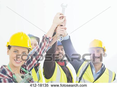 Portrait of construction workers joining hands View Large Photo Image Stock Photography - Portrait of construction workers joining hands. Fotosearch
