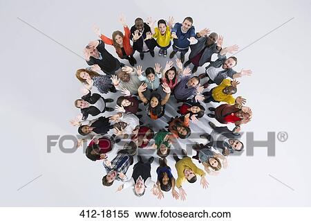 Stock Photography - Portrait of enthusiastic business people in circle. Fotosearch