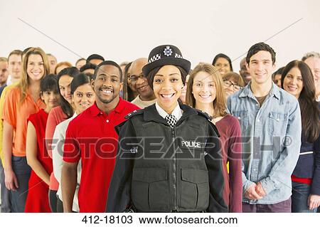 Portrait of smiling policewoman in front of large crowd View Large Photo Image Stock Image - Portrait of smiling policewoman in front of large crowd. Fotosearch