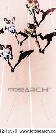 Relay runners racing on track View Large Photo Image Stock Photo - Relay runners racing on track. Fotosearch