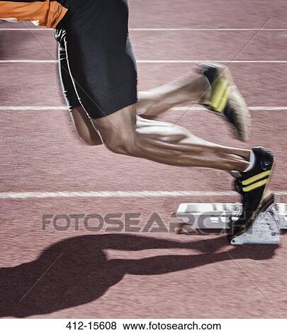 Runner taking off from starting block View Large Photo Image Stock Photo - Runner taking off from starting block. Fotosearch