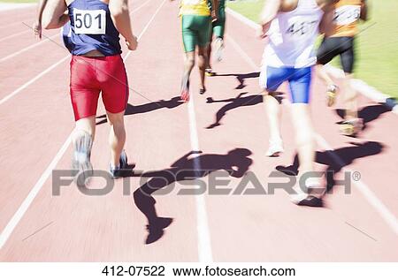 Runners racing on track View Large Photo Image Stock Image - Runners racing on track. Fotosearch