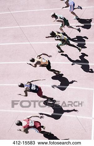 Runners racing on track View Large Photo Image Stock Image - Runners racing on track. Fotosearch