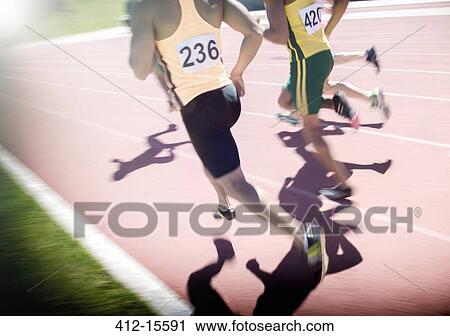 Runners racing on track View Large Photo Image Stock Image - Runners racing on track. Fotosearch