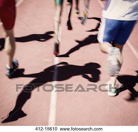 Runners racing on track View Large Photo Image Stock Image - Runners racing on track. Fotosearch