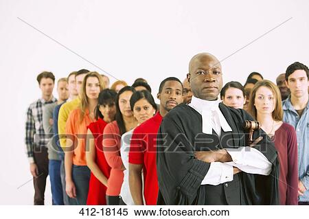 Stock Photography - Serious judge in front of crowd. Fotosearch