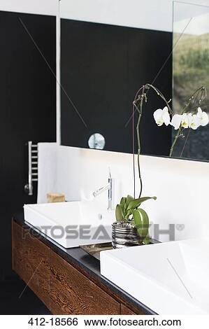 Stock Photograph - Sinks and mirrors in modern bathroom. Fotosearch