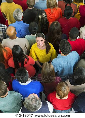 Smiling woman in crowd View Large Photo Image Stock Photo - Smiling woman in crowd. Fotosearch