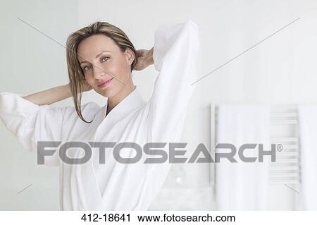 Smiling woman wearing bathrobe View Large Photo Image Stock Image - Smiling woman wearing bathrobe. Fotosearch