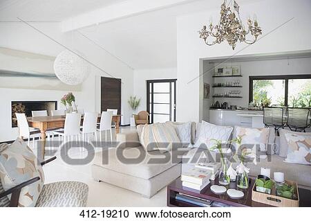 Sofa and dining table in modern living area View Large Photo Image Stock Image - Sofa and dining table in modern living area. Fotosearch