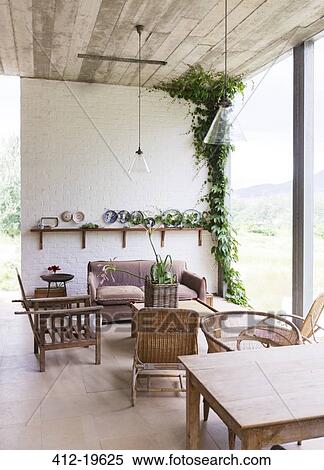 Sofa, chairs and table in rustic living room View Large Photo Image Stock Photography - Sofa, chairs and table in rustic living room. Fotosearch