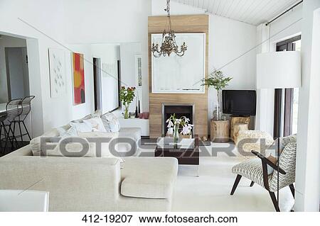 Sofa, coffee table and fireplace in modern living room View Large Photo Image Stock Photo - Sofa, coffee table and fireplace in modern living room. Fotosearch