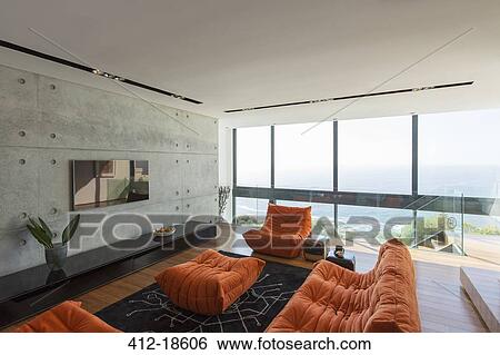 Sofas and ottoman in modern living room View Large Photo Image Stock Photograph - Sofas and ottoman in modern living room. Fotosearch