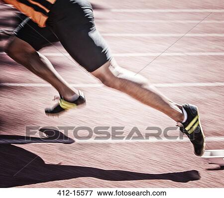 Sprinter taking off from starting block on track View Large Photo Image Stock Photo - Sprinter taking off from starting block on track. Fotosearch