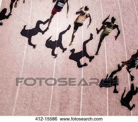 Sprinters racing on track View Large Photo Image Stock Photograph - Sprinters racing on track. Fotosearch