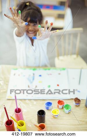 Student finger painting in classroom View Large Photo Image Stock Photo - Student finger painting in classroom. Fotosearch