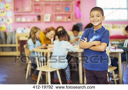 Student smiling in classroom View Large Photo Image Stock Image - Student smiling in classroom. Fotosearch
