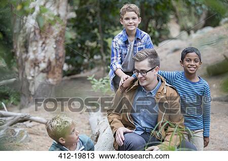Students and teacher playing in forest View Large Photo Image Stock Image - Students and teacher playing in forest. Fotosearch