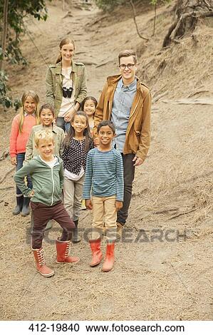 Students and teachers smiling in forest View Large Photo Image Stock Image - Students and teachers smiling in forest. Fotosearch