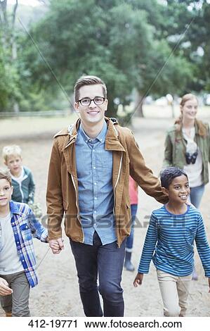 Students and teachers walking outdoors View Large Photo Image Stock Image - Students and teachers walking outdoors. Fotosearch