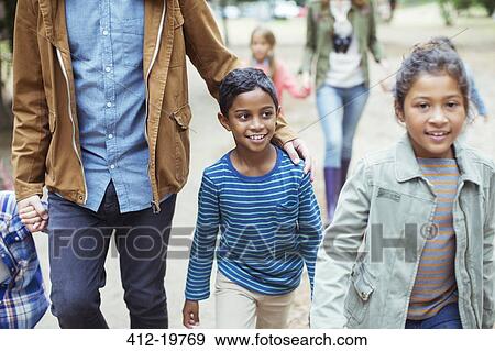 Students and teachers walking outdoors View Large Photo Image Stock Photo - Students and teachers walking outdoors. Fotosearch