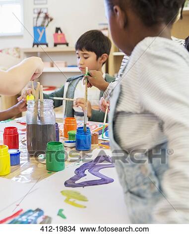 Students painting in classroom View Large Photo Image Picture - Students painting in classroom. Fotosearch