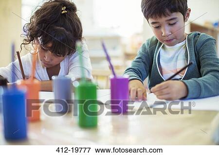 Students painting in classroom View Large Photo Image Stock Photo - Students painting in classroom. Fotosearch