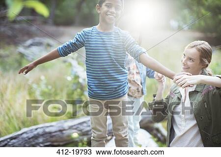 Teacher and student playing in forest View Large Photo Image Stock Image - Teacher and student playing in forest. Fotosearch
