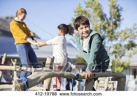 Teacher and students playing outdoors View Large Photo Image Stock Photo - Teacher and students playing outdoors. Fotosearch