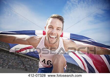 Track and field athlete cheering with British flag View Large Photo Image Stock Photo - Track and field athlete cheering with British flag. Fotosearch