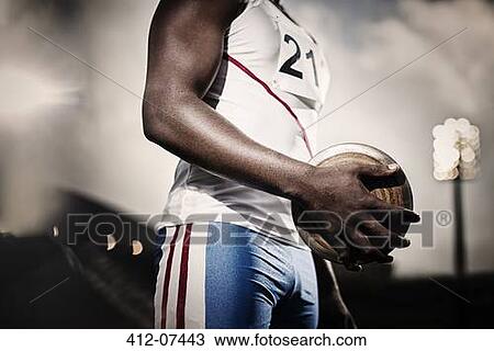 Track and field athlete holding discus View Large Photo Image Stock Image - Track and field athlete holding discus. Fotosearch
