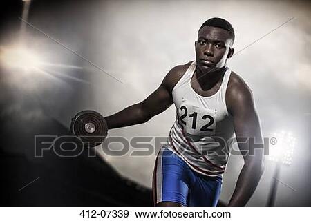 Track and field athlete holding discus View Large Photo Image Stock Photo - Track and field athlete holding discus. Fotosearch