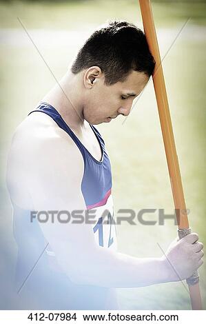 Picture - Track and field athlete holding javelin. Fotosearch