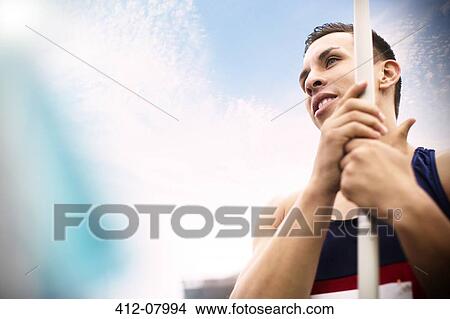 Track and field athlete holding javelin View Large Photo Image Picture - Track and field athlete holding javelin. Fotosearch