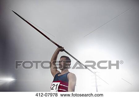 Track and field athlete holding javelin View Large Photo Image Stock Photo - Track and field athlete holding javelin. Fotosearch
